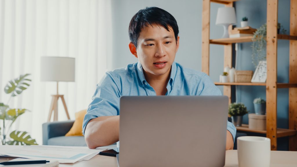 An individual participating in remote leadership coaching through a professional coaching service in Singapore.