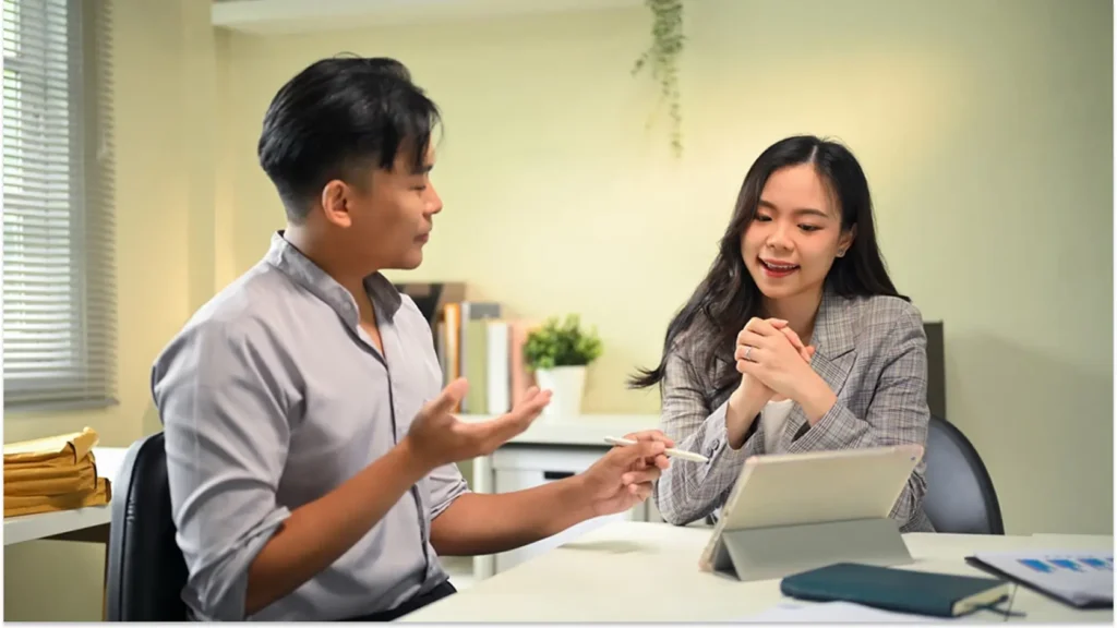 Career development coach in conversation with a client during a coaching session